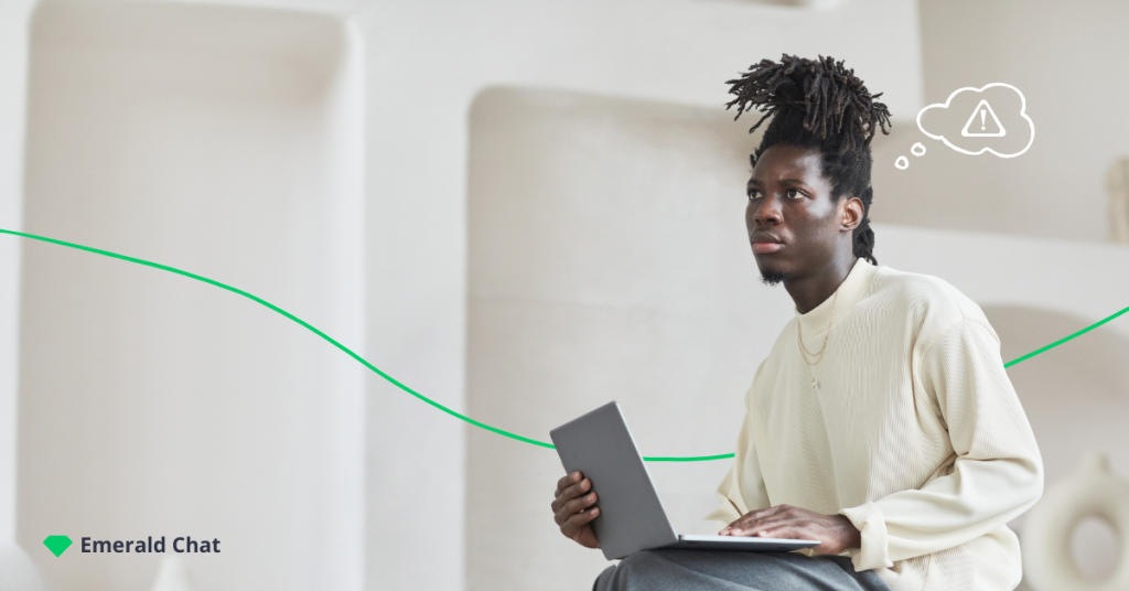 image of a african american male looking ahead while holding a laptop