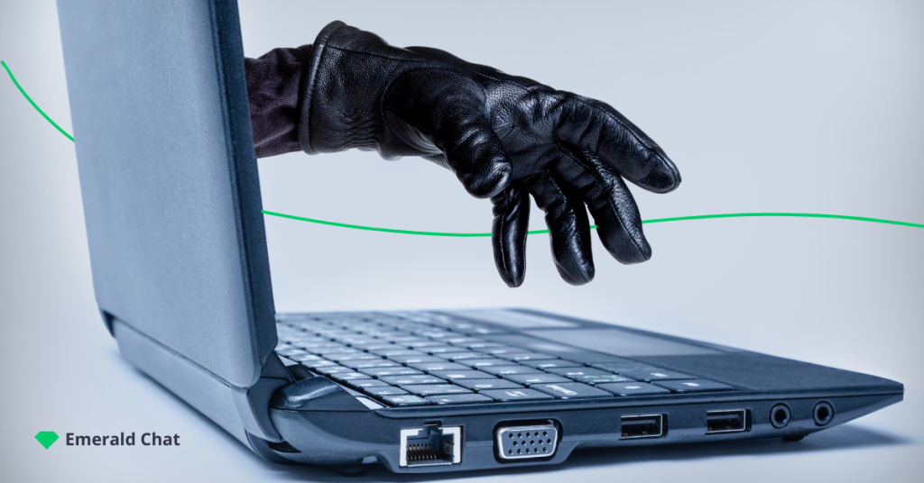 picture of a gloved hand reaching for a laptop